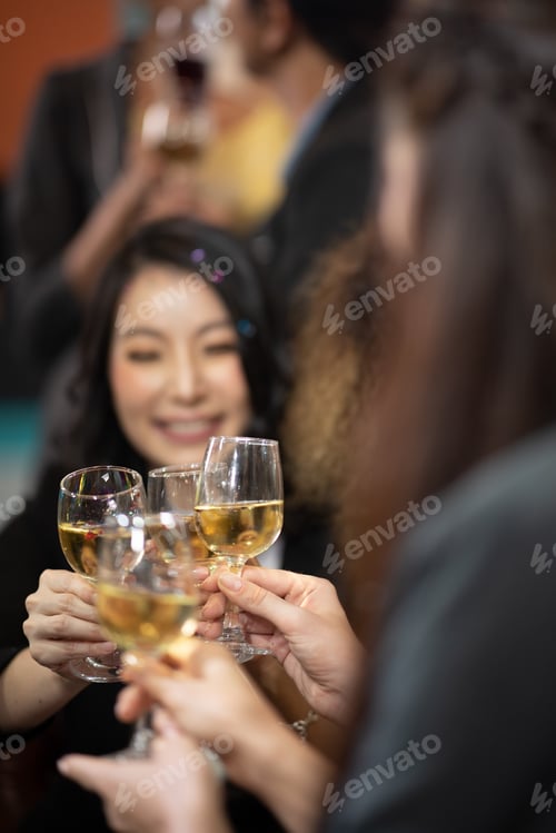 Preview: Business people drink wine At a party celebrating business success