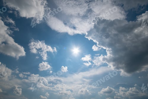 Preview: Blue sky with fluffy clouds and sun