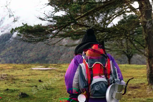 Preview: unrecognizable person in spades with red backpack