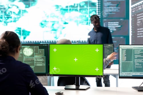 Preview: Hackers team working with a green screen layout on computer in monitoring room