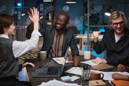 Preview: Business people happy with results at meeting