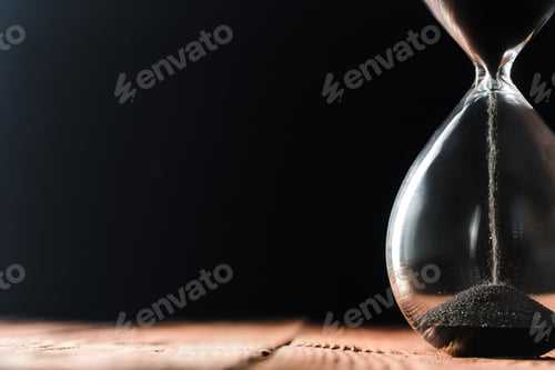 Preview: Modern hourglass on wooden background