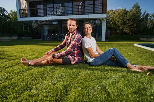Preview: Pretty lady and handsome male posing and looking at the photo camera in the countryside