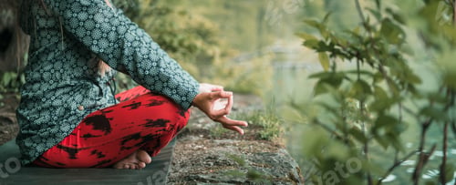 Woman Meditating Outdoors on Yoga Mat Near Water