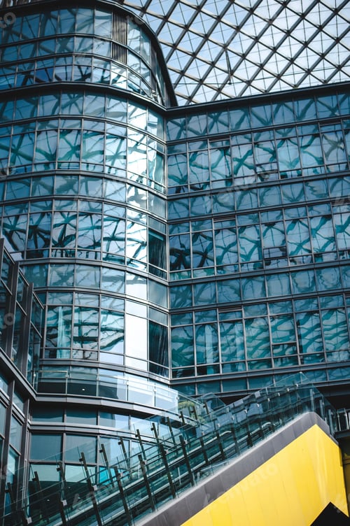 Preview: Modern architectural glass facade with reflections.