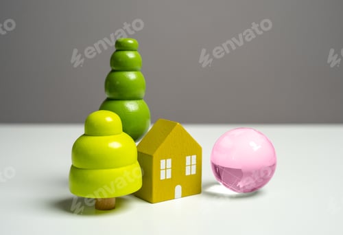 Preview: Figures of a house and a globe of planet earth.