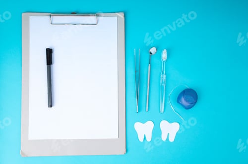 Preview: Clipboard and Dental Tools on Blue Background for Oral Health Presentation