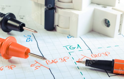 Preview: Cables of multimeter and electric fuse on construction drawing of house. Building home concept