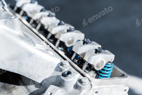 Preview: Closeup car racing motorsport v8 engine valve parts springs garage workshop workbench repair factory