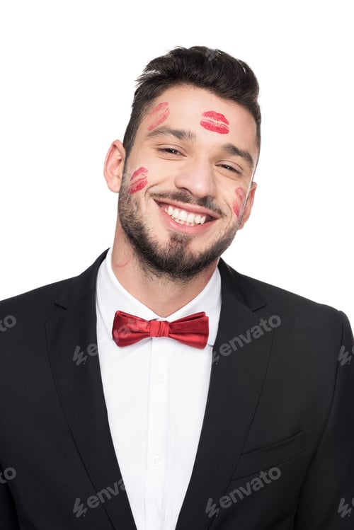 Preview: laughing handsome man with lips traces on face isolated on white