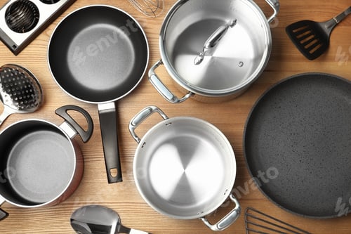 Preview: Flat lay composition with clean cookware on wooden background