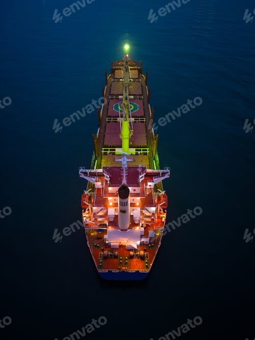 Preview: Aerial view cargo bulk carrier ship on the sea at night