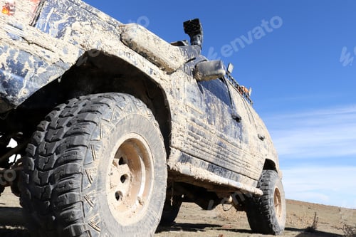 Preview: Off-road vehicle in muddy terrain.