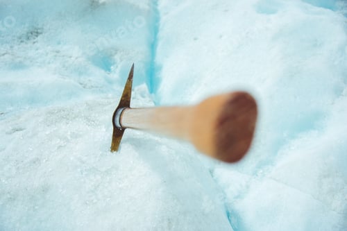Preview: Pickaxe in ice on glacier work tool