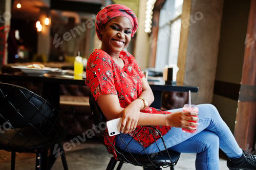 Preview: Stylish african woman in red shirt and hat