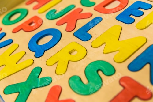 Preview: Alphabet with wooden letters in a children's classroom.