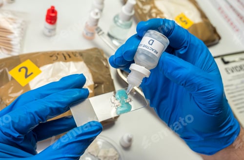 Preview: Scientific police hold positive drug reagent at crime lab, conceptual image