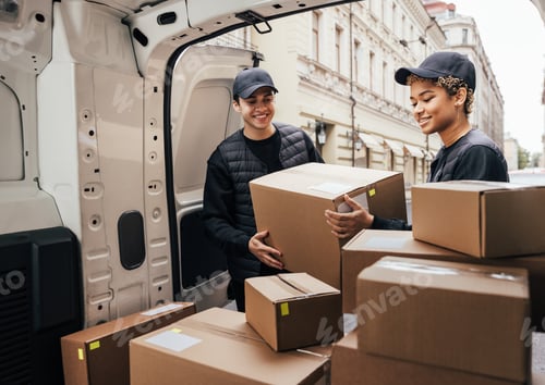 Preview: People working for a delivery company. Couriers load packages into a car.
