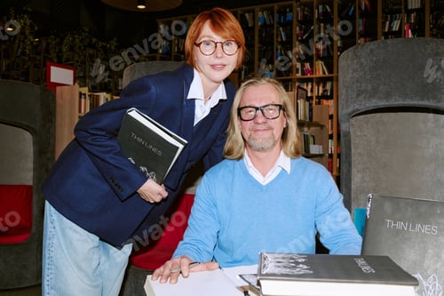 Preview: Caucasian Middle Aged Author and Middle Aged Woman at Book Presentation