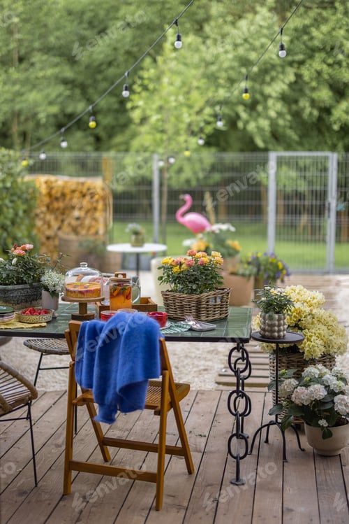 Preview: Beautiful backyard with festively served dinner table