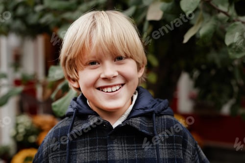 Preview: Portrait of Caucasian Child Boy Smiling Outdoors in Village Setting