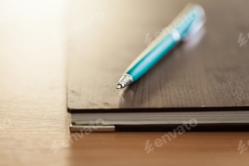 Preview: Blank note paper with pen on wood background
