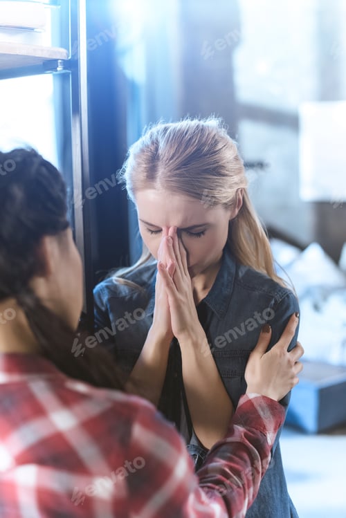 Preview: Young woman supporting her girlfriend in depression