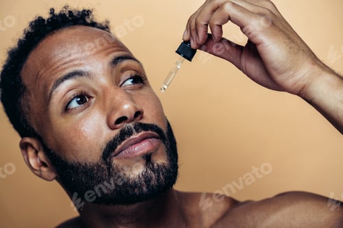 Preview: Image of a young man taking care of his skin