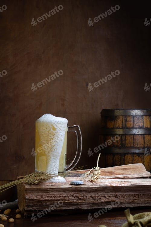 Preview: Vertical shot of a craft beer in glass on a wooden table and a barrel in the background