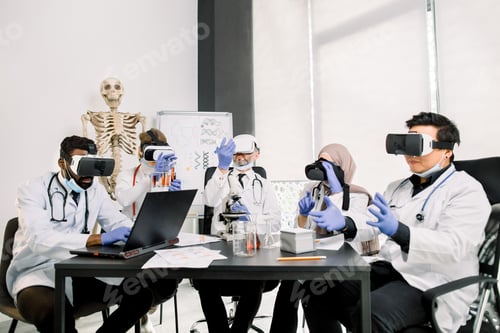 Preview: Scientists with vr goggles for biochemistry test in modern lab. African man works on laptop