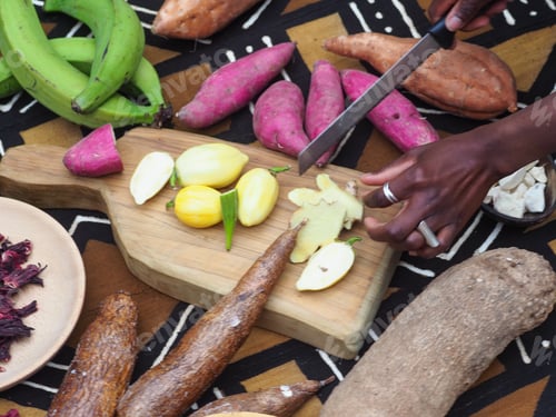 Preview: closeup of man hands african cut vegetables fry on the table .vegan healthy food