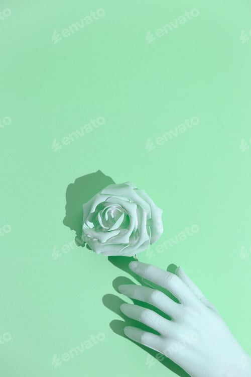 Preview: Aqua menthe trends aesthetic. Minimal still life design. Fake hand and roses