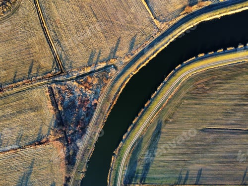 Preview: Drone shot of a river in a field