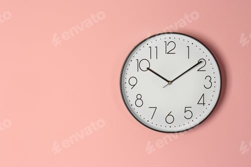 Preview: Stylish analog clock hanging on color wall. Space for text