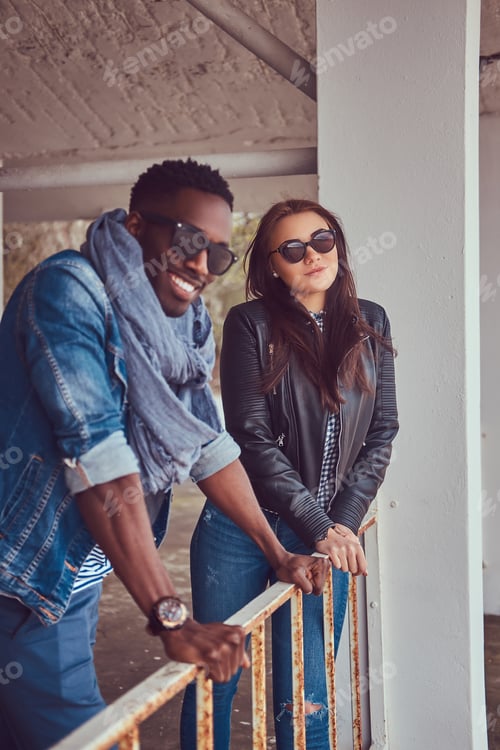 Preview: Portrait of an attractive stylish couple. African-American guy w