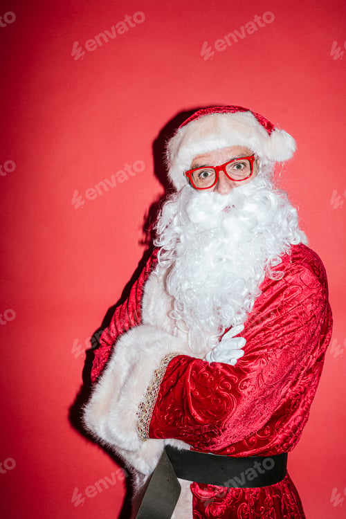 Preview: Man dressed as Santa Claus gesturing with funny glasses