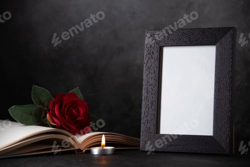 Preview: picture frame with red flower and burning candle on dark background tank death war
