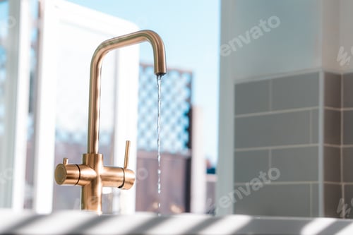 Preview: Gold kitchen tap faucet and sink, clean home interior