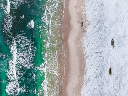 Preview: Fishing boats on white snowy beach in winter.