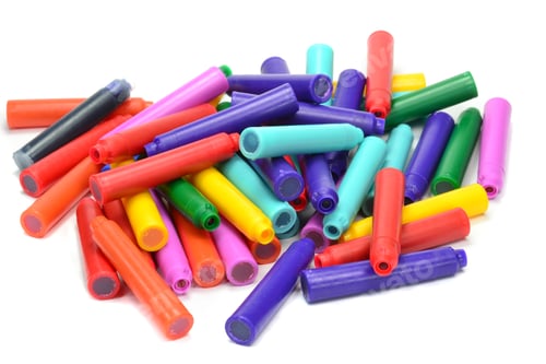 Preview: Colorful Collection of Crayon Tops on White Background