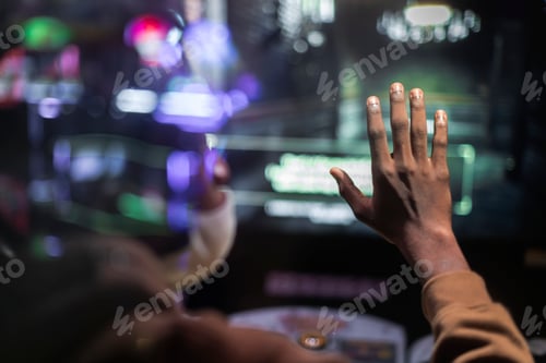 Preview: Hand touching a window with neon lights