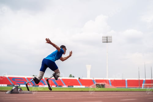 Preview: Asian athletes are disabled with prosthetic blades running at stadium.
