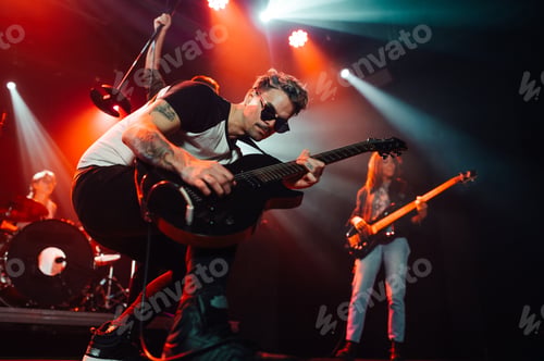 Preview: Guitarist performing live on stage with band