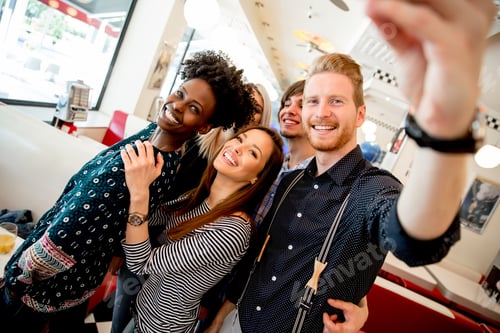 Preview: Group of young people taking selfie with mobile phone