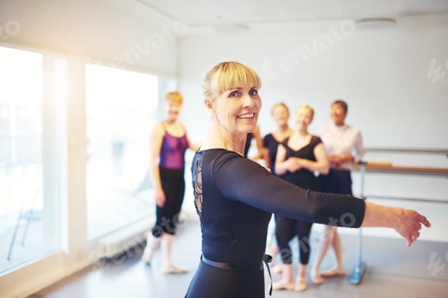 Preview: Senior woman practicing ballet in a dance studio