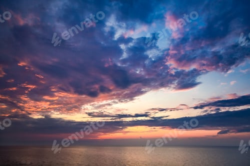 Preview: Beautiful sunset over calm sea in summer