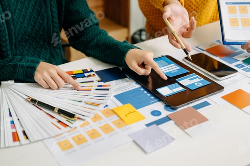 Preview: UX developer and ui designer brainstorming about mobile app interface wireframe design