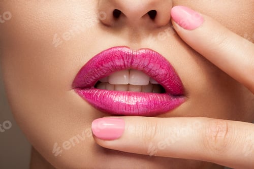Preview: Lips with pink lipstick in close up photo