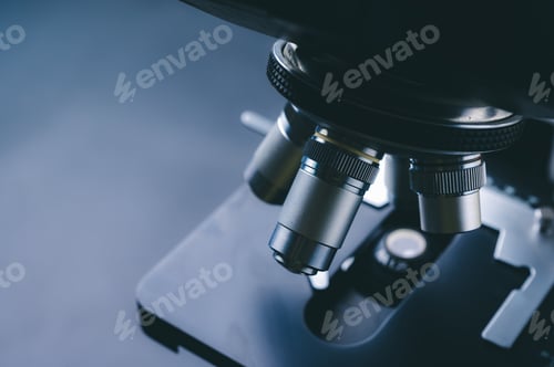 Preview: Laboratory equipment optical microscope, closeup of scientific microscope with metal lens