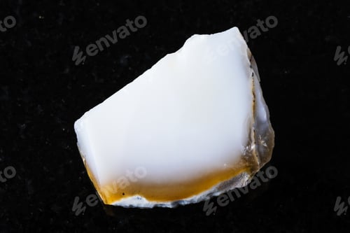 Preview: sample of rough white opal mineral on black